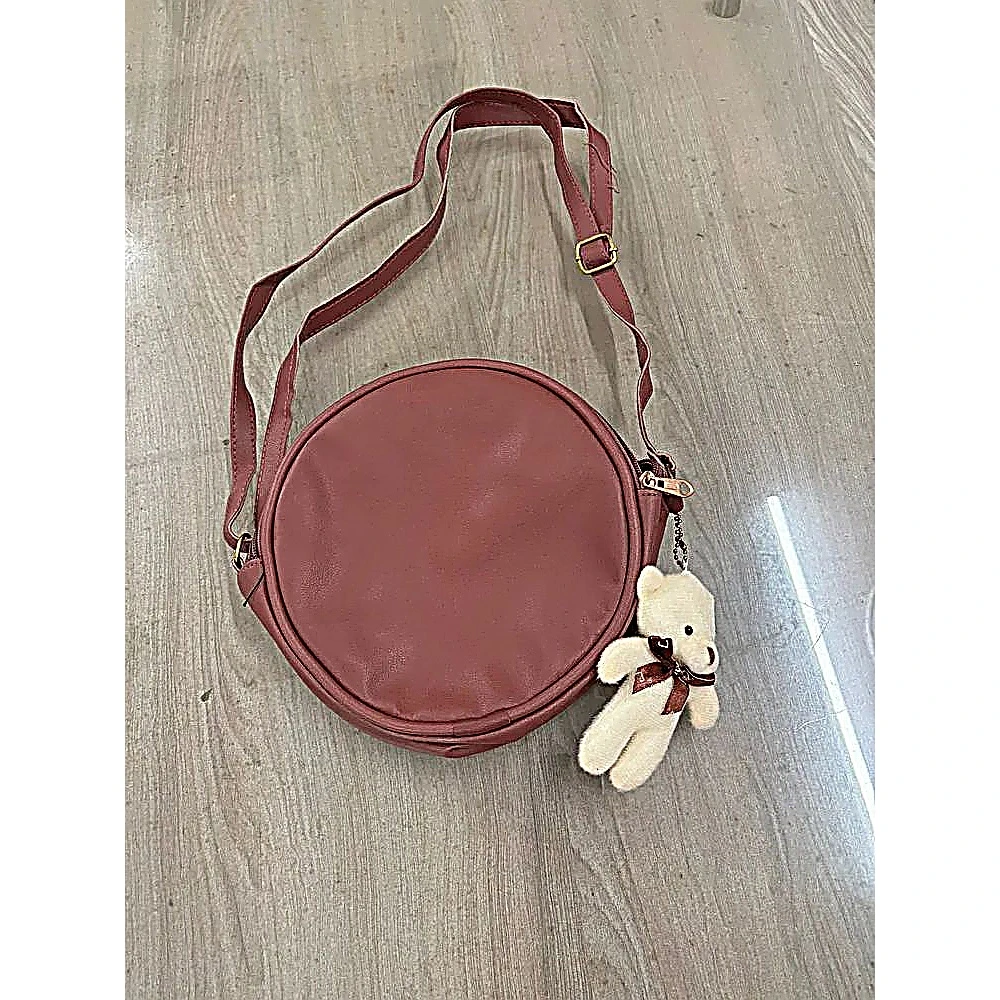 ROUNDED SLING BAG